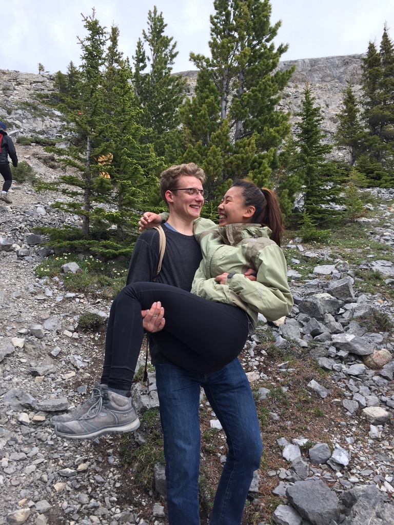 nate carrying diane on a hike